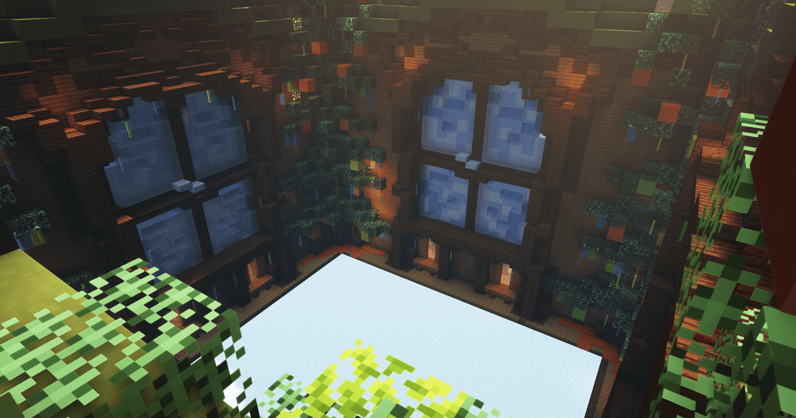Minecraft winter build from the Salad holiday block party: a brick hall with tall windows, decorated trees, and a snowy floor