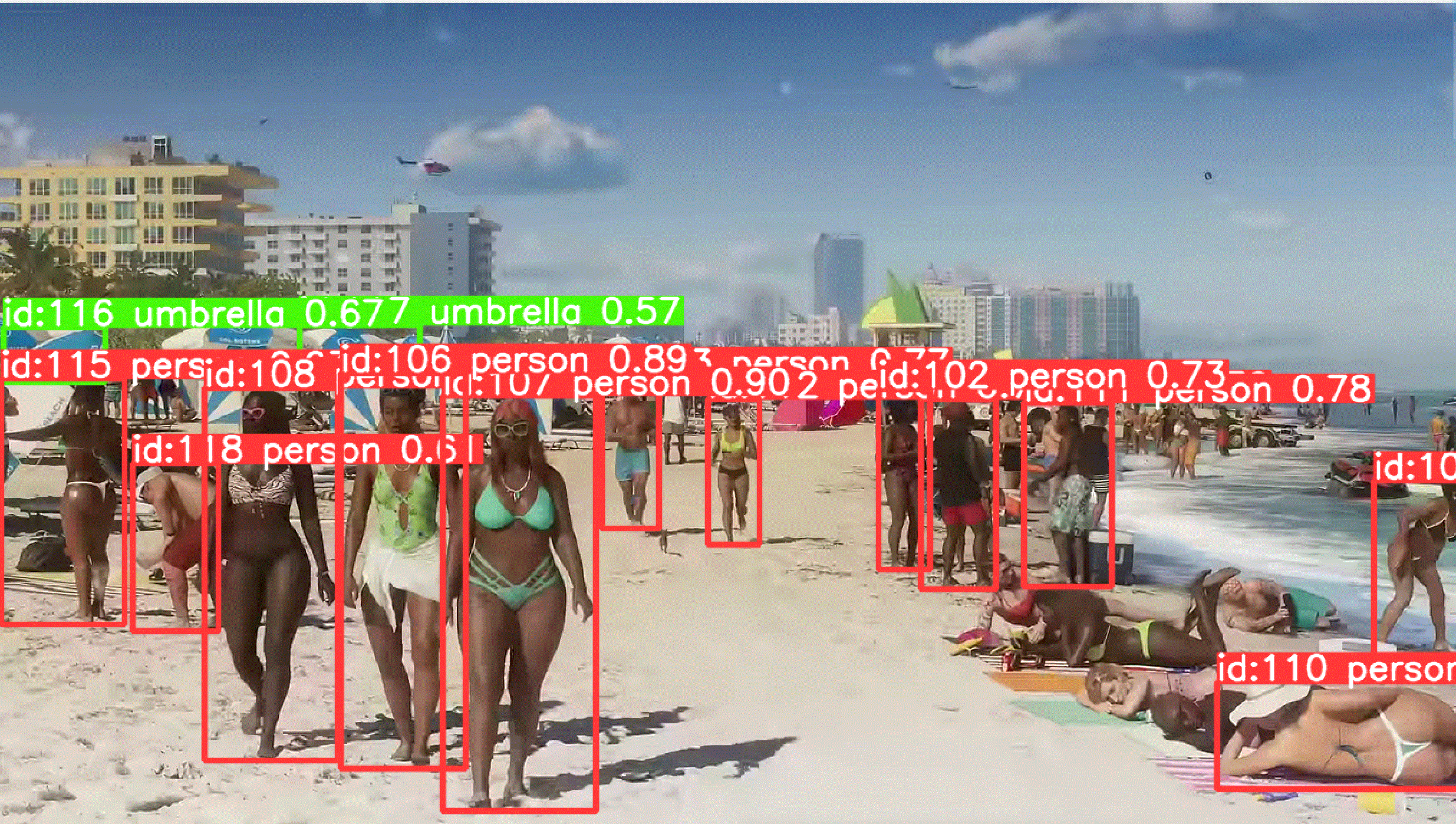 Crowded Vice City beach scene from the GTA 6 trailer with YOLOv8 tracking dozens of people and umbrellas, each box labeled with an ID and confidence score